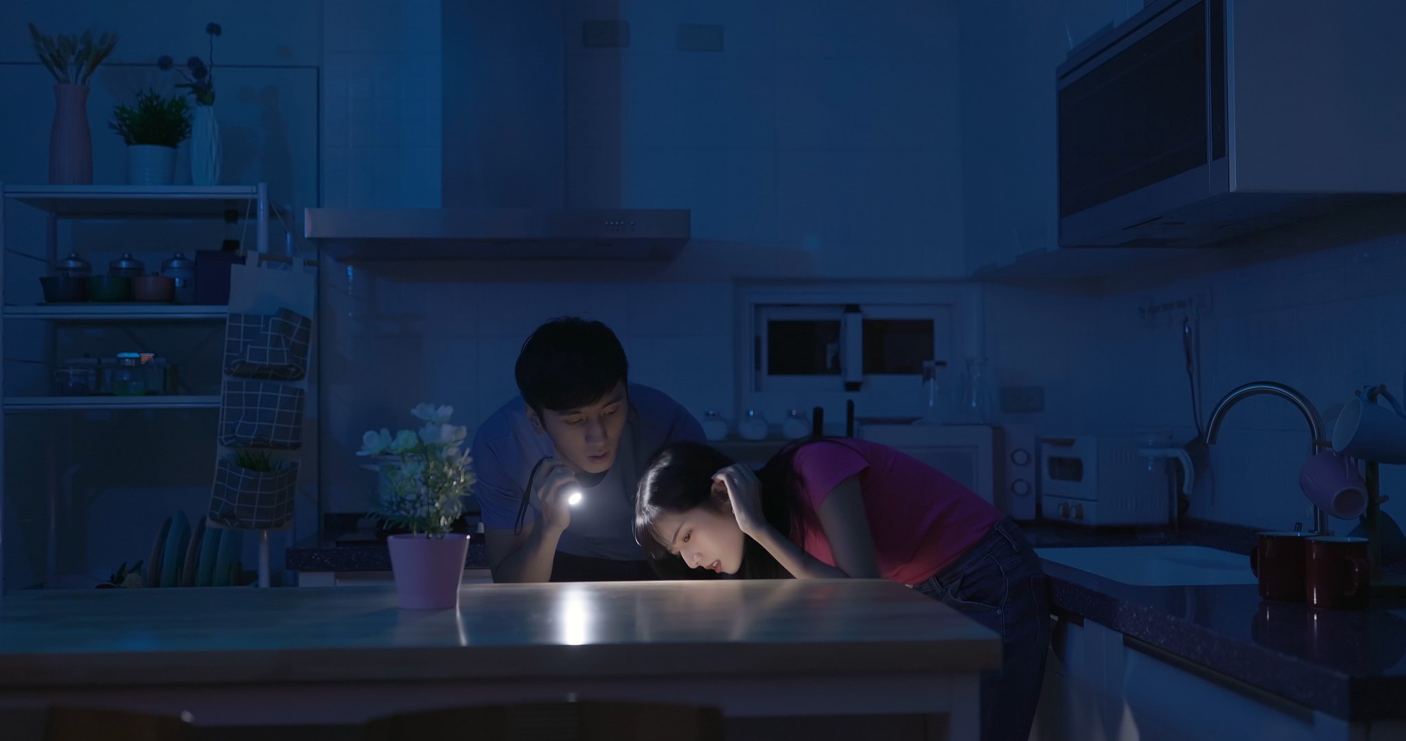 asian couple with power outage